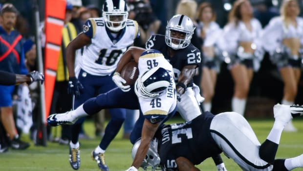 Aug 19, 2017; Oakland, CA, USA; Oakland Raiders defensive tackle Darius Latham (75) tackles Los Angeles Rams tight end Cory Harkey (46) during the third quarter at Oakland Coliseum.